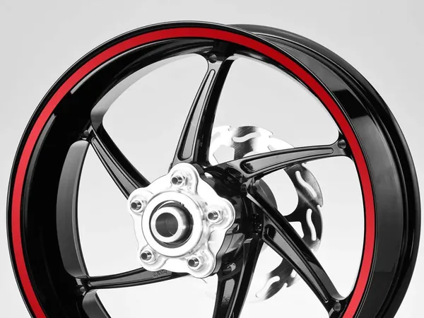 Red rim stripe sticker on a motorbike wheel