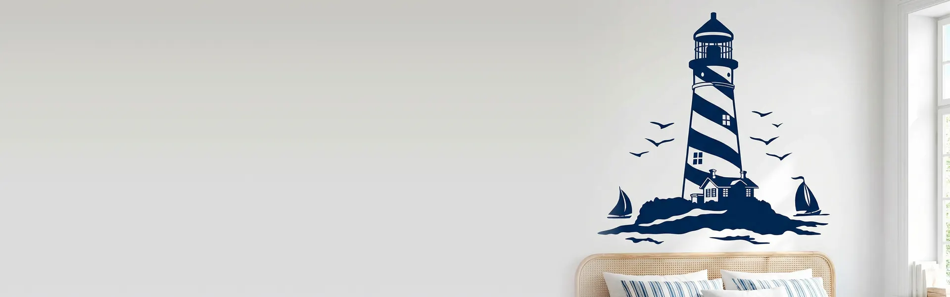 Navy blue lighthouse, sailing boats and seagulls wall sticker above a bed
